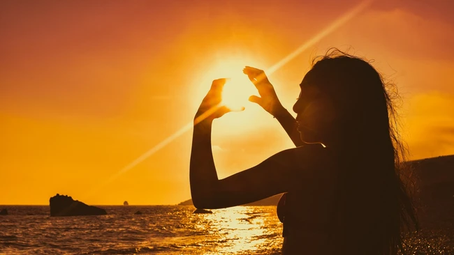 Girl Holding Sun