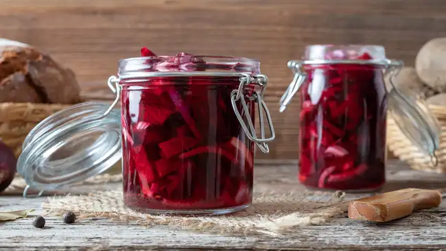 Fermented beet kvass in two glass jars